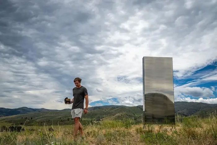 Harrison Fraser visits the mysterious monolith on the northwest hill of Fort Collins, June 27.