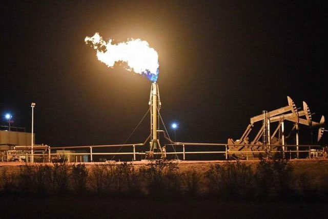 The pipes continuously spewing flames at oil fields do not burn oil but rather burn associated natural gas.