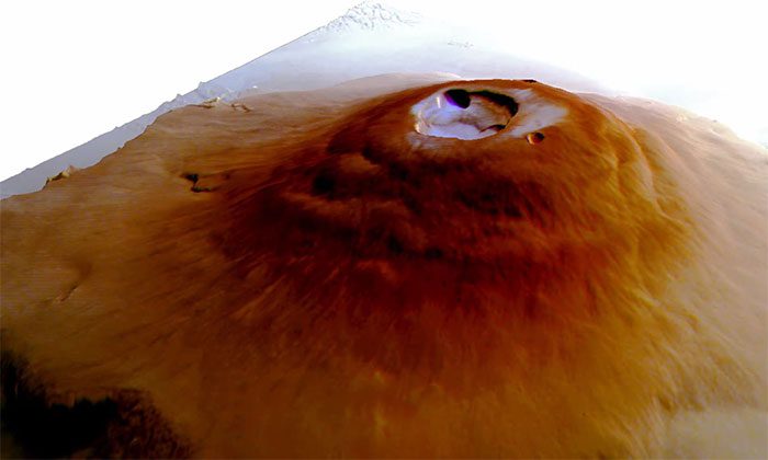 Frost discovered early in the morning on top of giant volcanoes on Mars.