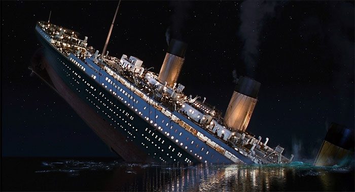 The Titanic sinking into the sea.