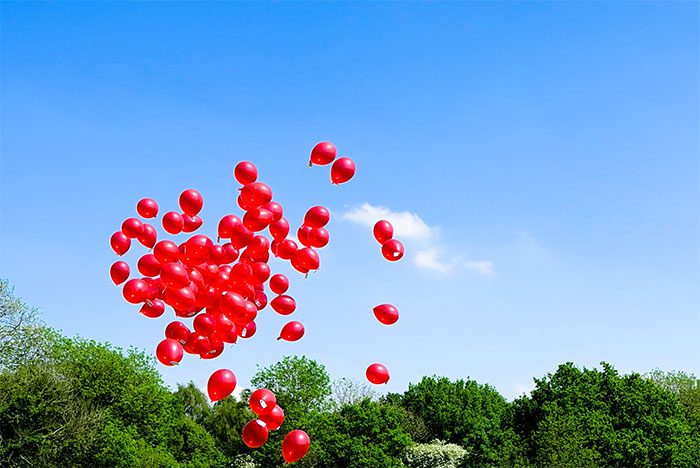 Releasing balloons into the sky