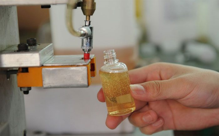 The bottling process of e-liquid at a factory in China.