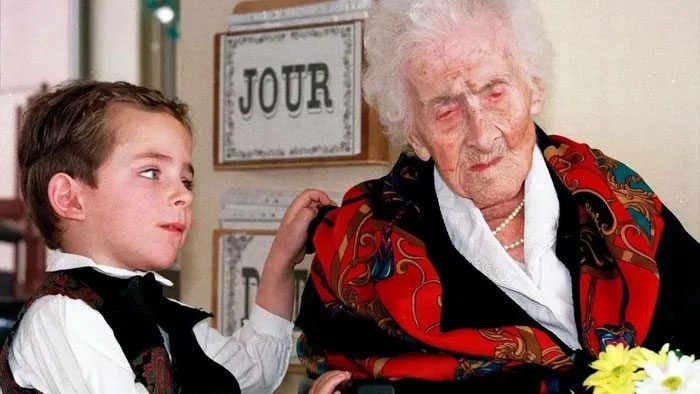 Jeanne Calment (right) recognized as the world's oldest person at 122 years.