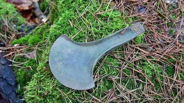 One of the five crescent-shaped axes found in a forest in Poland.