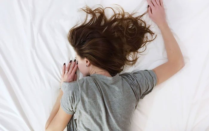 Waking up with neck pain can be caused by many factors