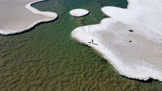 Crystal-clear lakes interspersed with salt flats in Atacama