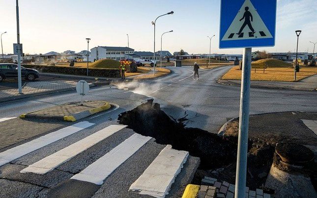 Close-up of cracks and sinkholes that have formed in Grindavík.