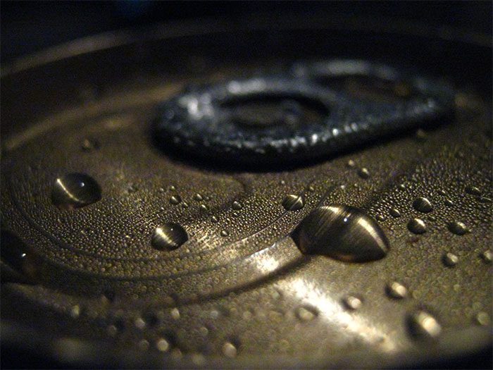 Photons (light particles) have knocked water molecules out, causing the phenomenon of evaporation.