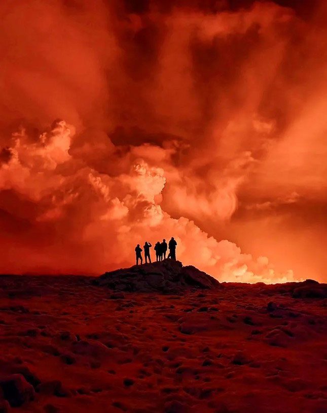 Local residents can see smoke rising from the eruption north of Grindavík