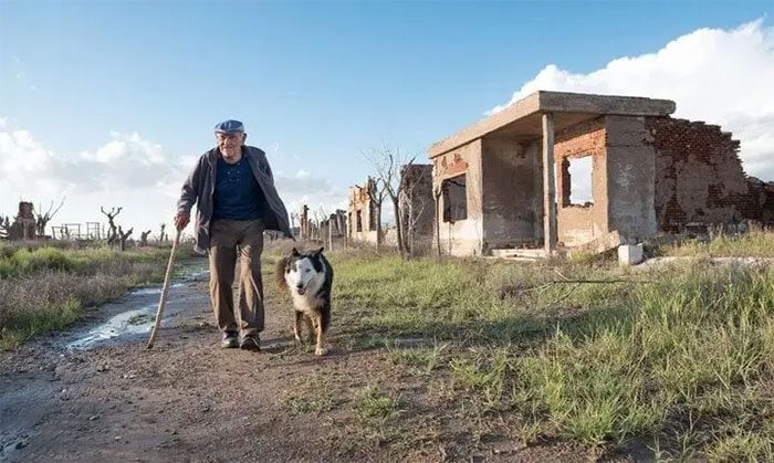 Every day, Mr. Pablo walks around the town with his dog.