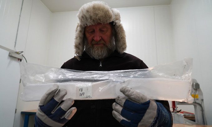 Joergen Peder Steffensen holding an ice core sample