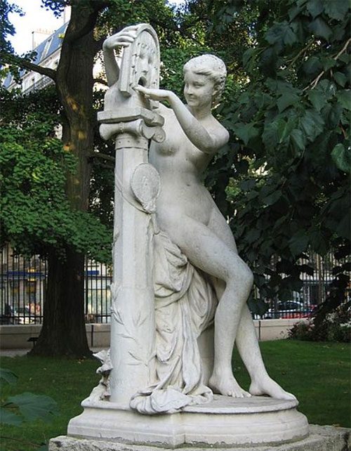 A woman placing her hand into the “Mouth of Truth”.