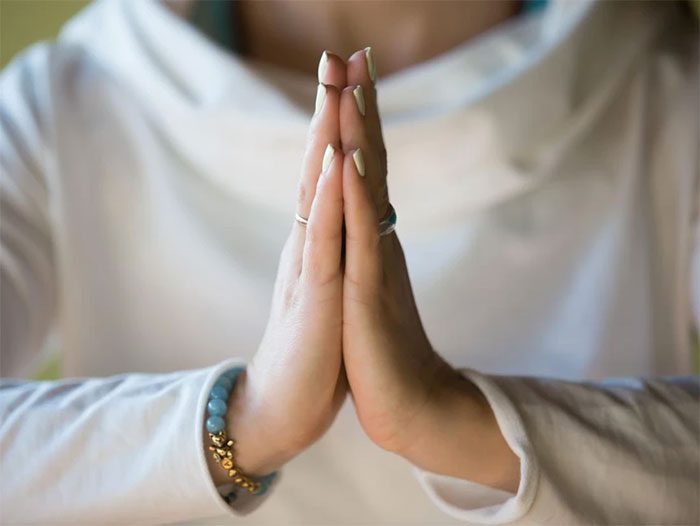 Wrist exercise in the prayer position.