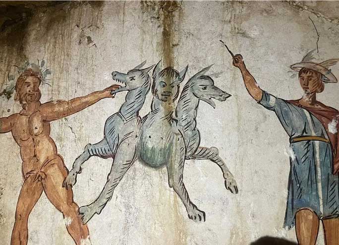 The main fresco depicts the central figure, the demon Cerberus guarding hell