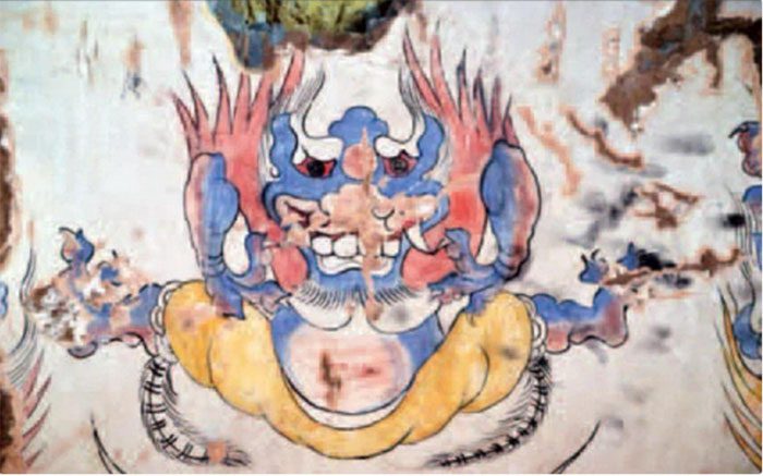 The mural depicting the "green monster" in the ancient tomb.