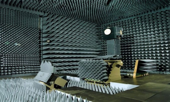 Cobalt blue conical structures used to absorb sound waves in the GEMAC chamber.