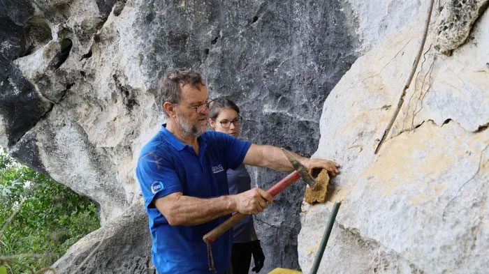 The Paris University team collecting stone samples at the Mo Set quarry in the Tam Chuc complex.