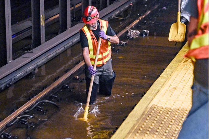 A worker attempts to address the situation so the subway can resume operations as soon as possible