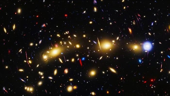 NASA Unveils Stunning New Image of the Christmas Tree Galaxy Cluster, Known as MACS0416.