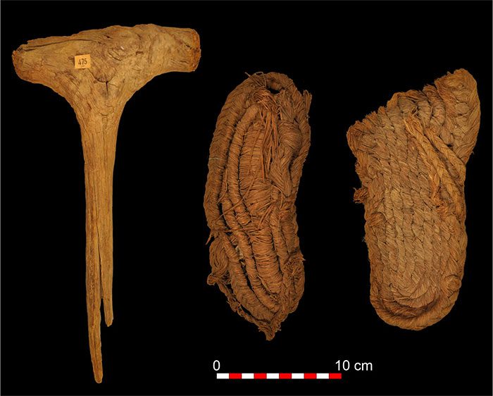 Wooden mace (left) and 2 sandals discovered in Spain.