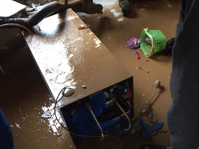 Residents' electrical appliances submerged for days in floodwaters.