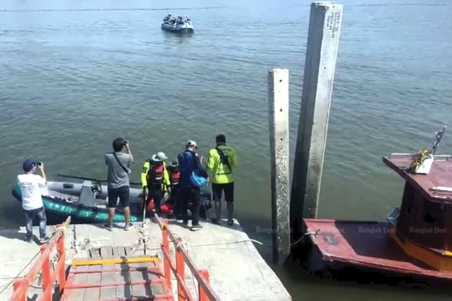 Rescue team working near the site where the boat capsized.