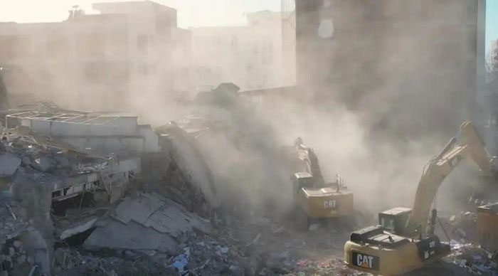Demolition teams clearing rubble after the earthquake in Hatay province, Turkey.
