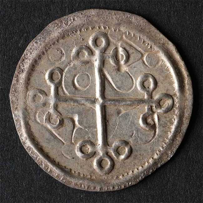 Cross-shaped coin.