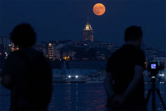 Photographers capturing the rare astronomical event at Galata Tower