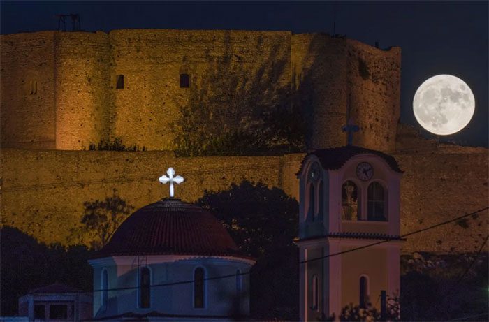 The Supermoon behind the medieval Chlemoutsi Castle in Kyllini, Peloponnese, Greece.
