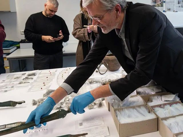 Artifacts from the three treasures being classified by scientists