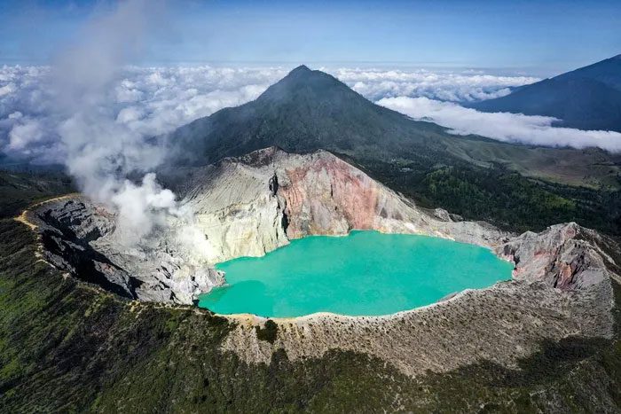 The turquoise color of Kawah Ijen Lake is due to high acid concentrations and dissolved metals.