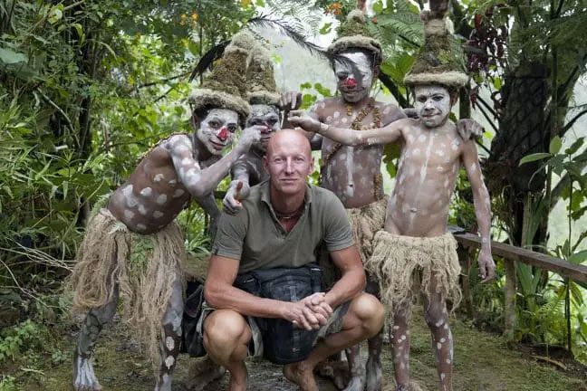 Jimmy Nelson with young members of the Goroka tribe at the border of Indonesia.