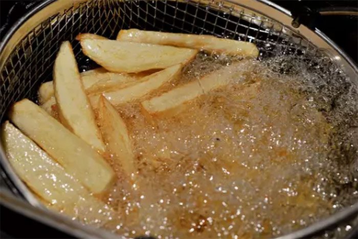 Fried potatoes can produce acrylamide due to high-temperature processing.