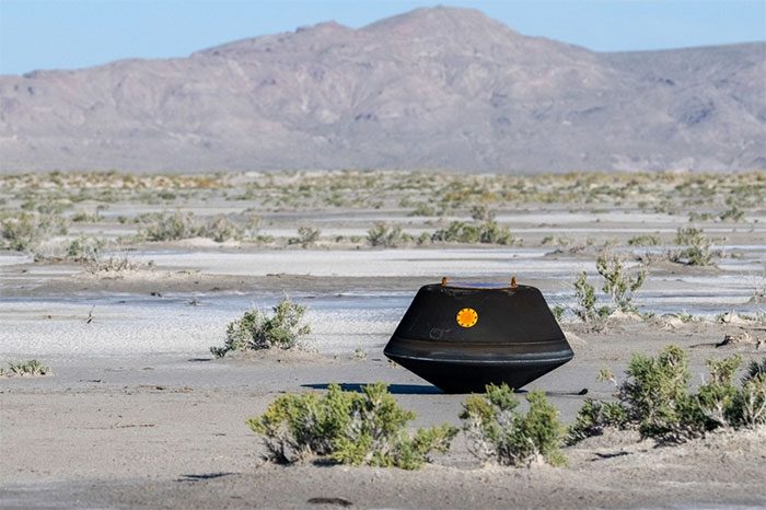The sample capsule safely landing on Earth.