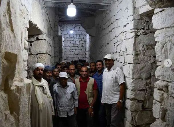 Scientists in a reinforced passage inside the Sahure pyramid