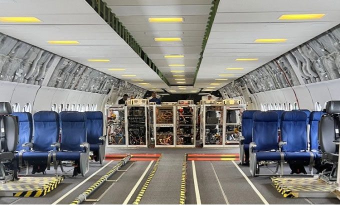 Spacious interior of the 777X aircraft.