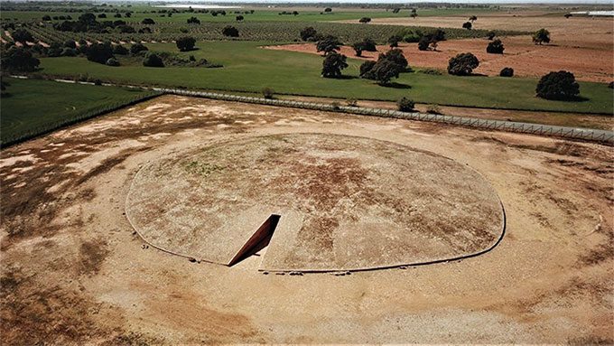 The dolmen consists of a circular earth mound with a long passage leading to a chamber.