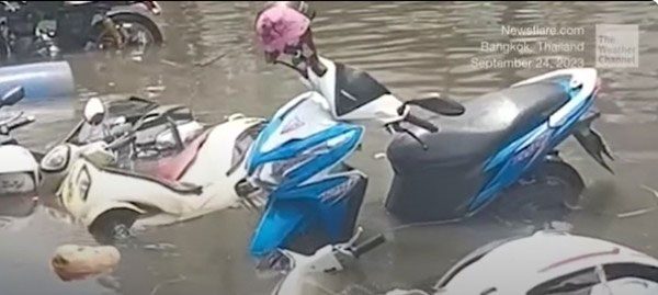 Motorcycles submerged in floodwaters in Bangkok, Thailand due to the tropical depression.
