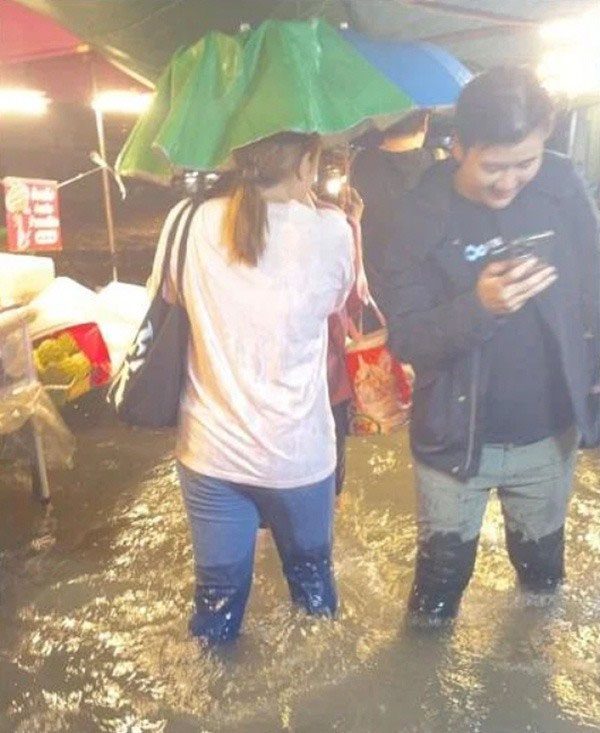 Heavy rain flooding streets in Bangkok, Thailand on the evening of September 26.
