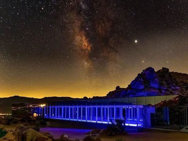 The Invisible House at night.