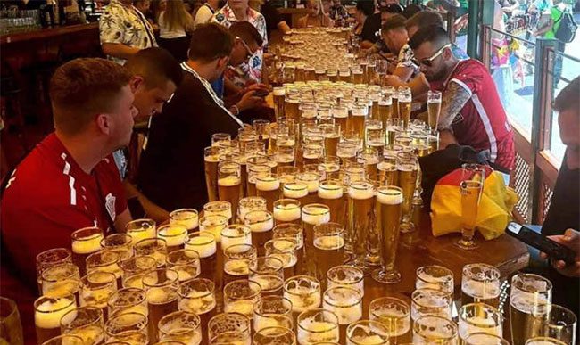 The group of tourists participating in the beer drinking record attempt.