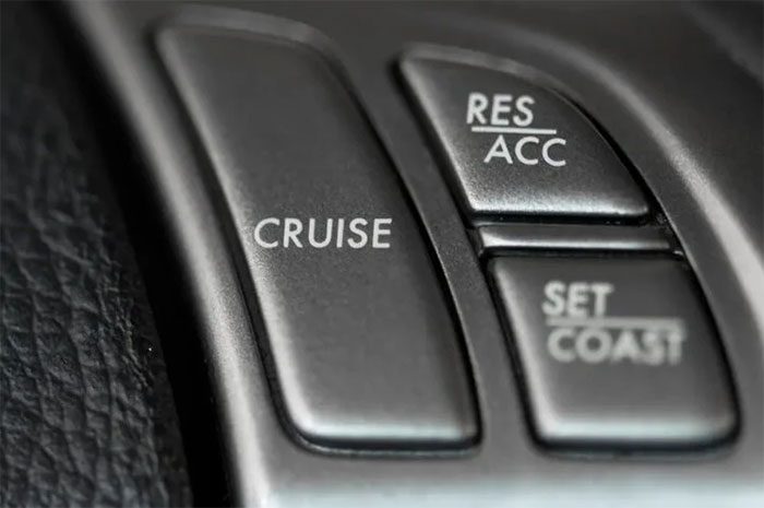 Cruise control adjustment button on a car steering wheel.