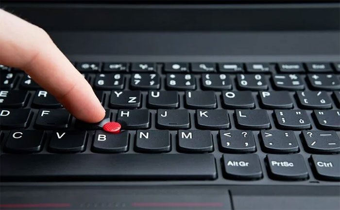 Some laptops have a "red button" in the middle of the keyboard.