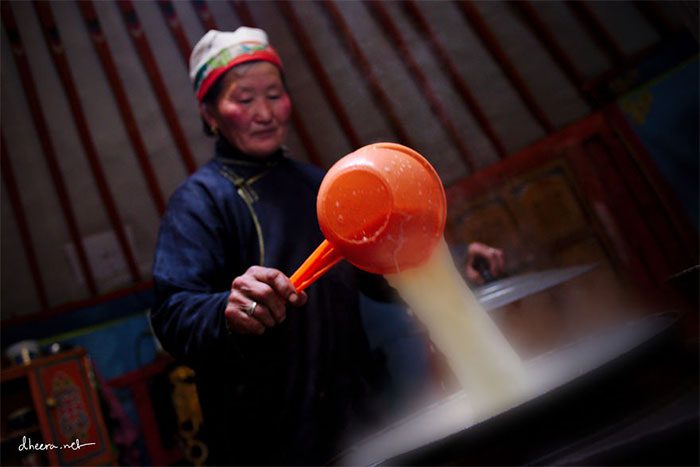 A woman preparing traditional Mongolian milk tea