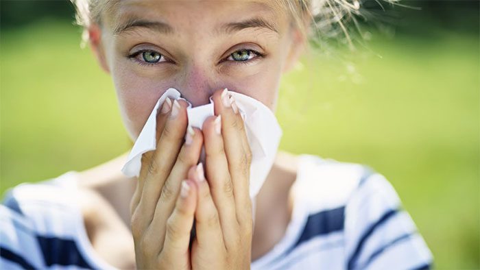 Allergic reactions can cause sore throat and congestion in the ears.