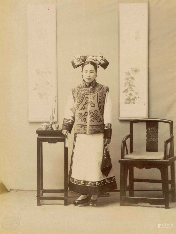 A woman dressed in noble attire, taken before 1906.
