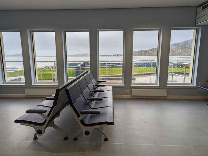The seats overlook the beach runway.