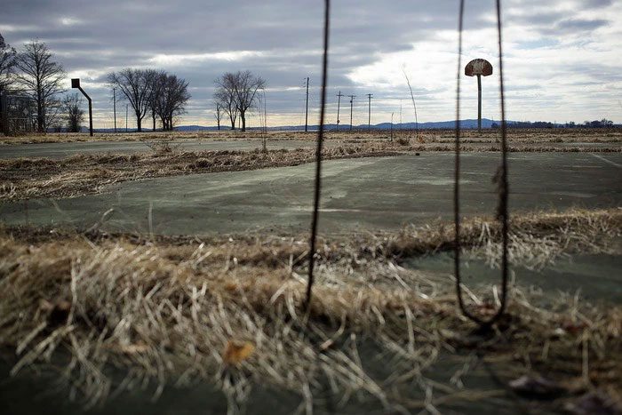 Old basketball court at the abandoned Valmeyer high school.