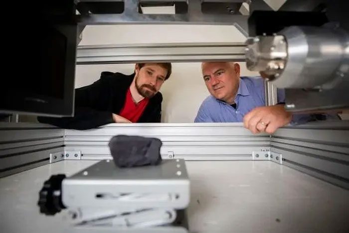Seth Parker and Brent Seales from the Digital Restoration Initiative project.